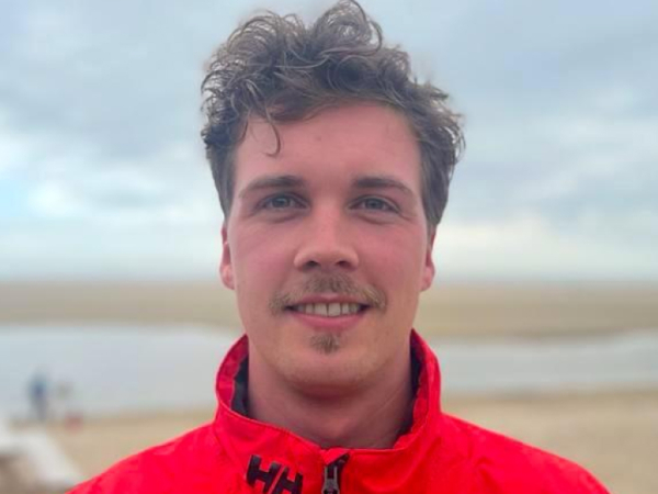 A head shot of Marius, a senior Sea Ranger. Marius is wearing a red Sea Ranger jacket.